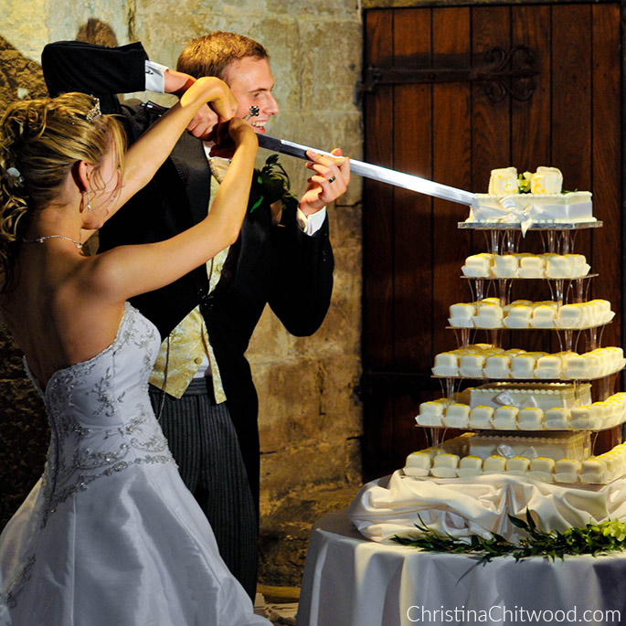 Christina and Tom Cutting the Cake with a Sword