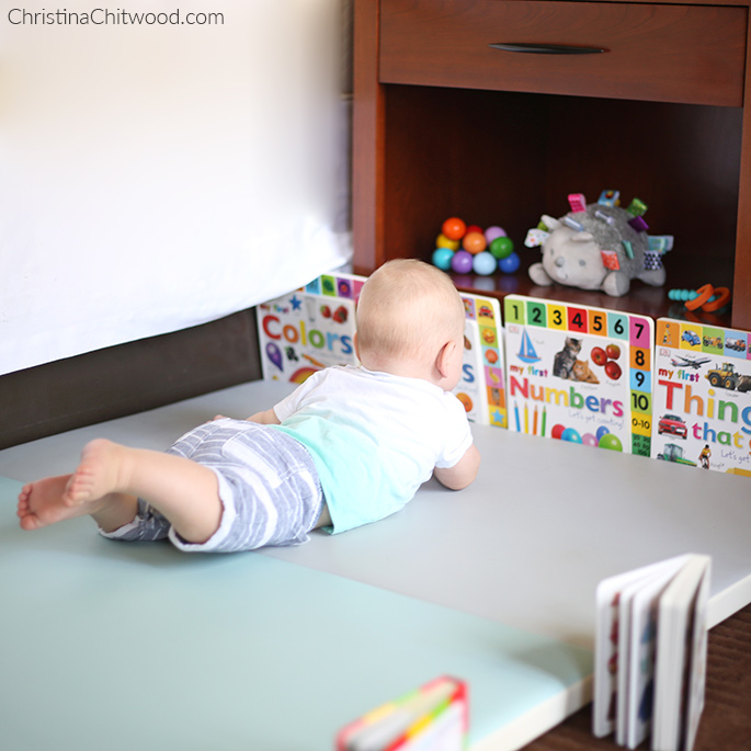 Our Baby Boy Gettiing a Close Look at the Books in His Montessori Space on His Fourth Trip at 5 Months Old