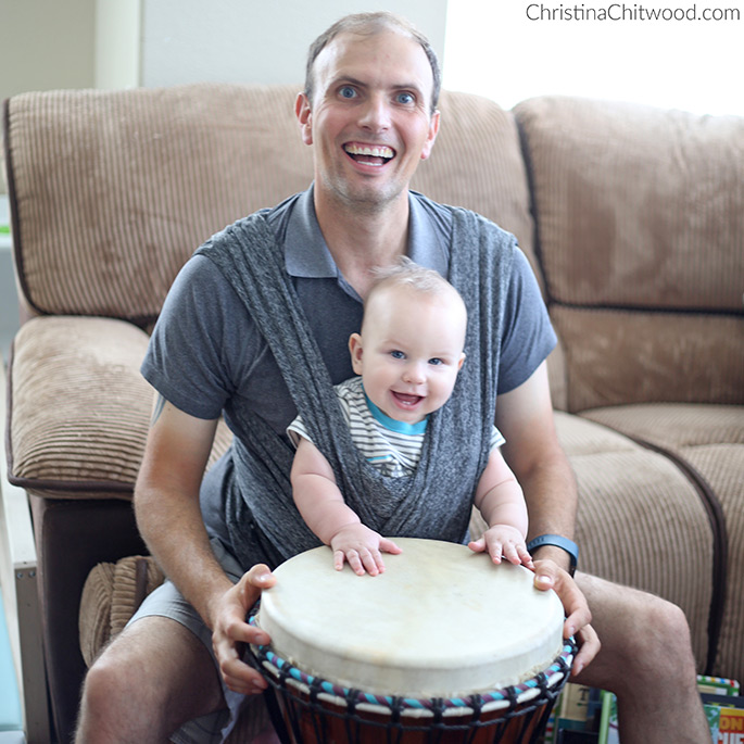 Daddy Babywearing His Baby Boy at 7 Months Old While Playing the Djembe Drum